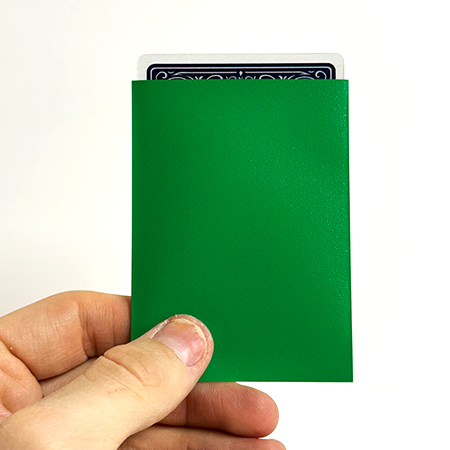 Green opaque-back TCG card sleeve holding a playing card
