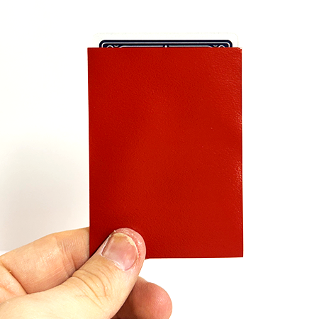 Red TCG card sleeve holding playing cards Red TCG card sleeve holding playing cards